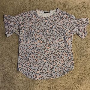 Women’s Glitzy Girl, animal print, ruffled, short sleeve blouse